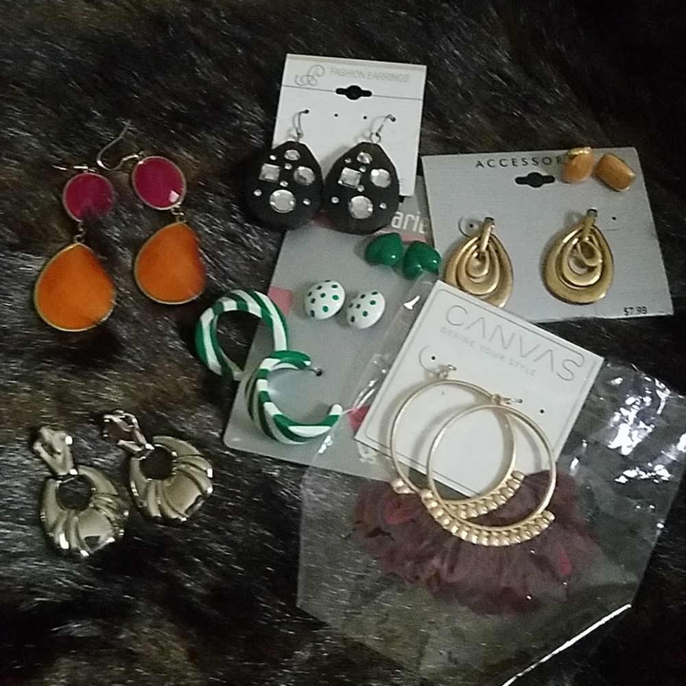 A grouping of earrings most brand new with tags